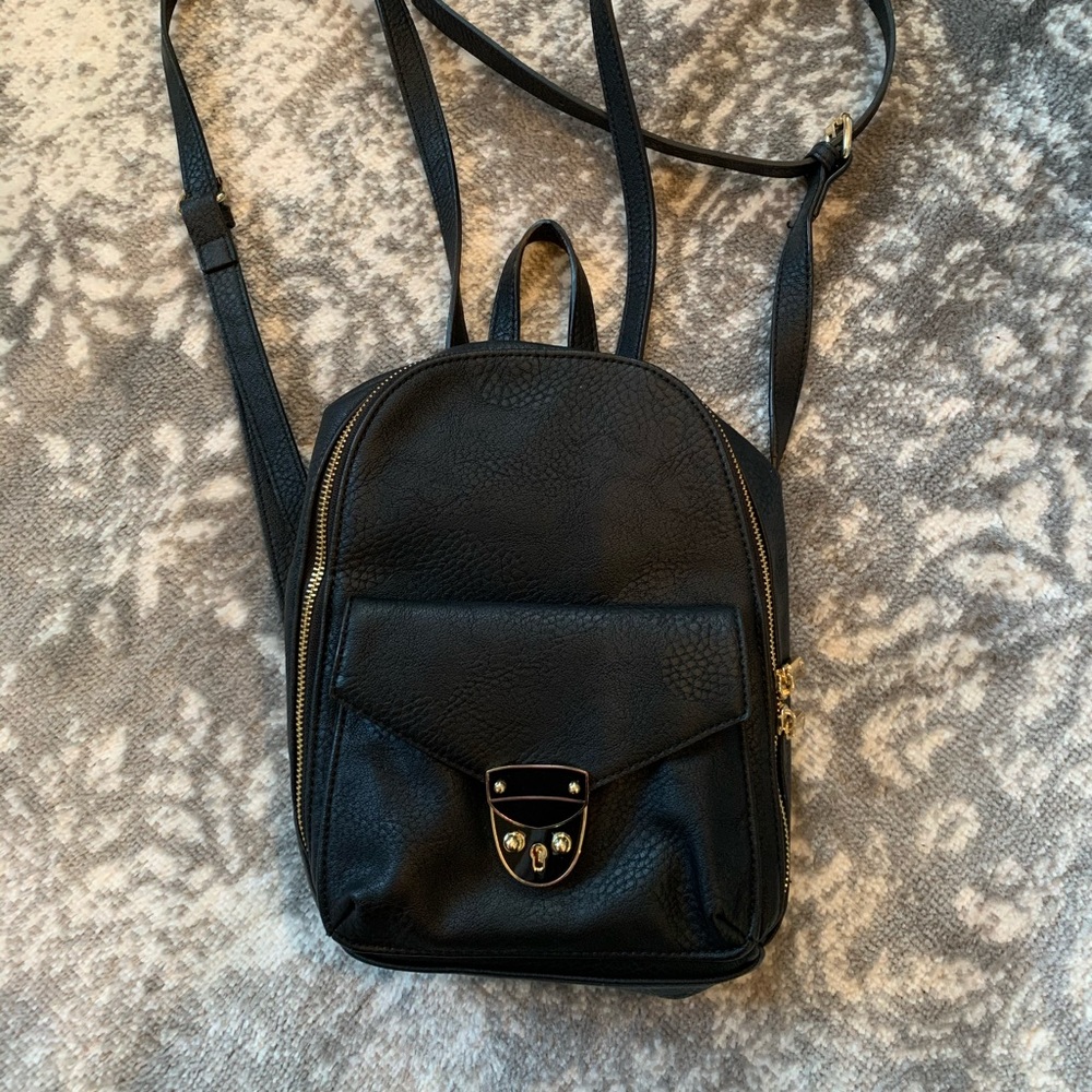 Charming Charlie faux leather backpack